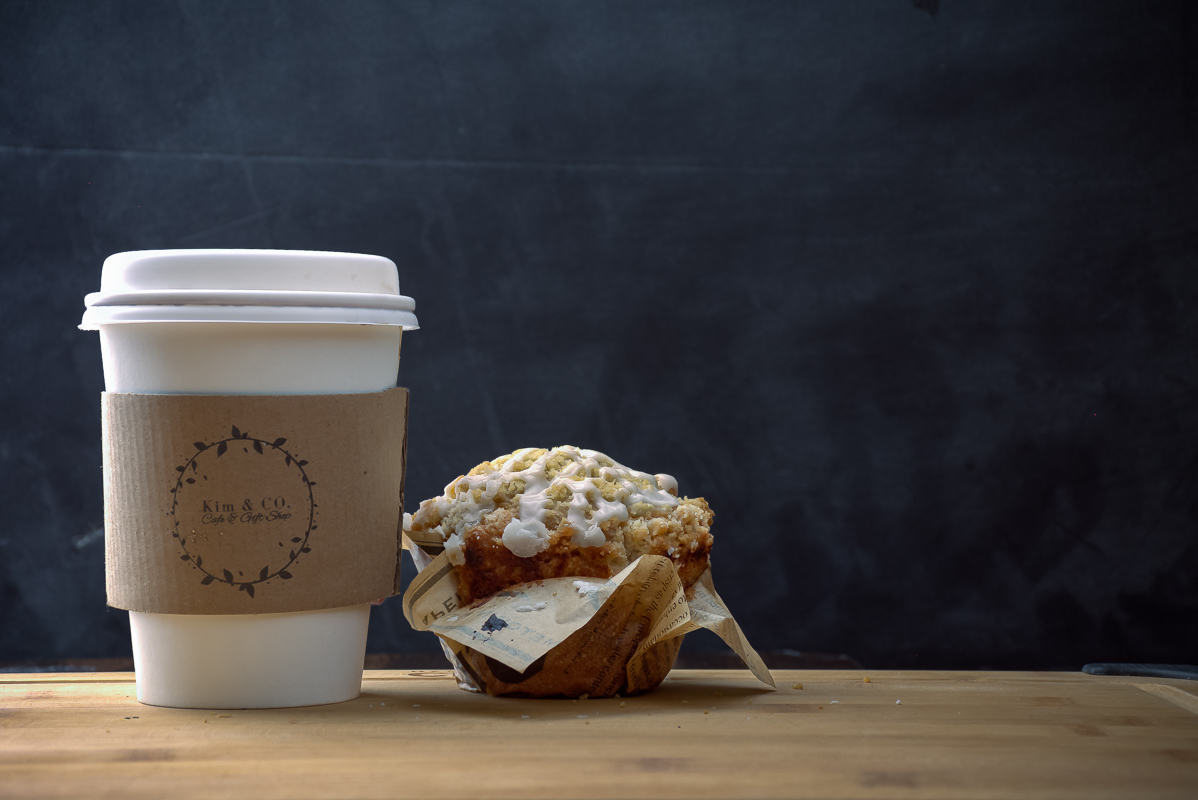 paper cup of coffee and a muffin by David Thielen