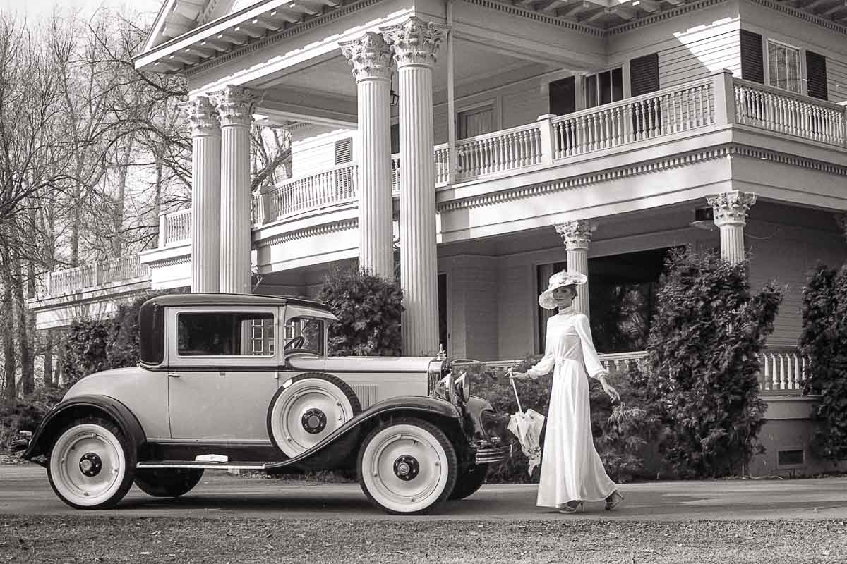 Antique car and model in front of Norland Estates by David Thielen
